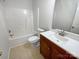 Bathroom featuring a vanity, a toilet, and a bathtub at 3600 Sipes Ln, Charlotte, NC 28269