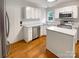 Kitchen featuring stainless steel appliances, an island, and hardwood floors at 3600 Sipes Ln, Charlotte, NC 28269