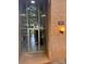 Close-up of building entrance with glass door, globe lighting fixtures and unit number at 417 Orchard Trace Ln # 6, Charlotte, NC 28213