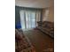 Living room featuring patterned sofas, blinds, and carpet at 417 Orchard Trace Ln # 6, Charlotte, NC 28213
