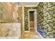 Updated bathroom with a glass-enclosed shower and decorative tropical wallpaper at 46 Timberidge Dr, Lake Wylie, SC 29710