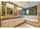 Beautiful bathroom with a double vanity, garden tub, and designer wallpaper at 46 Timberidge Dr, Lake Wylie, SC 29710