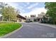 Exterior of a golf clubhouse with well-maintained landscaping and convenient golf cart parking at 46 Timberidge Dr, Lake Wylie, SC 29710