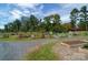 A lovely community garden, complete with plots and greenery, provides a tranquil space to connect with nature at 46 Timberidge Dr, Lake Wylie, SC 29710