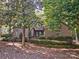 Charming home featuring mature trees and manicured landscaping at 46 Timberidge Dr, Lake Wylie, SC 29710