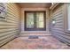 Elegant double doors with brick entryway and decorative sidelight at 46 Timberidge Dr, Lake Wylie, SC 29710