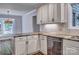Kitchen featuring granite countertops, stainless steel dishwasher and white cabinets at 46 Timberidge Dr, Lake Wylie, SC 29710