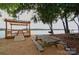 Enjoy the covered picnic area and a sandy beach by the lake, perfect for relaxation and outdoor activities at 46 Timberidge Dr, Lake Wylie, SC 29710