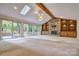 Bright living room with vaulted ceiling, fireplace, and built-in shelving at 46 Timberidge Dr, Lake Wylie, SC 29710