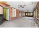 Large sunroom with brick walls, tile flooring, and multiple windows for ample natural light at 4608 Beatties Ford Rd, Charlotte, NC 28216