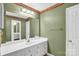 Bathroom featuring vintage-inspired wall paper, lighting and vanity at 4738 Truscott Rd, Charlotte, NC 28226