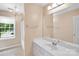 Bathroom featuring vintage wallpaper and ample lighting at 4738 Truscott Rd, Charlotte, NC 28226