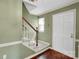 Inviting entryway featuring a staircase, hardwood floors, and a neutral color scheme at 4738 Truscott Rd, Charlotte, NC 28226