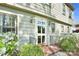 Close-up of the front door with sidelights, brick steps and detailed trim with fresh landscaping at 4738 Truscott Rd, Charlotte, NC 28226