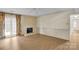 Inviting living room with wood floors, fireplace, and french doors that let in lots of natural light at 4738 Truscott Rd, Charlotte, NC 28226