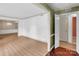 Bright open-concept living room showcasing laminate floors and direct access to the dining area at 4738 Truscott Rd, Charlotte, NC 28226