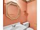 Charming powder room featuring unique wallpaper, mirror and fixtures at 4738 Truscott Rd, Charlotte, NC 28226