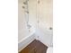 Clean bathroom features a shower over bath and a door, designed for modern living at 5013 Prestwick Ln, Charlotte, NC 28212