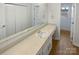 Bathroom boasts a spacious countertop, white cabinets, and ample storage at 5013 Prestwick Ln, Charlotte, NC 28212