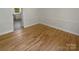 Bright dining room features hardwood floors, white walls, and decorative molding for a clean, modern feel at 5013 Prestwick Ln, Charlotte, NC 28212