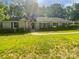 Charming single-story home featuring a well-manicured lawn and inviting curb appeal at 5013 Prestwick Ln, Charlotte, NC 28212