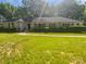 Charming single-story home with lush green lawn, mature trees, and manicured shrubbery at 5013 Prestwick Ln, Charlotte, NC 28212