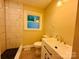 Modern bathroom with a new vanity, stylish faucet, and tiled shower at 509 North St, Belmont, NC 28012