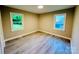Bedroom with newer flooring and windows providing lots of natural light at 509 North St, Belmont, NC 28012