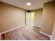 Comfortable bedroom featuring hardwood floors, a closet, and an open door at 509 North St, Belmont, NC 28012