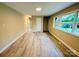 Open-concept living room with hard wood flooring, offering plenty of space and natural light at 509 North St, Belmont, NC 28012