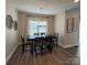 Elegant dining room with modern lighting, a spacious table, and tasteful decor at 5118 Regents Park Dr, Hickory, NC 28602