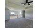 Open loft area featuring a view of the house and natural light, creating a versatile space at 5118 Regents Park Dr, Hickory, NC 28602