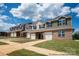 Newly constructed townhomes showcasing brick and siding, complemented by attached garages and manicured lawns at 5153 Tommy Ln # 1104, Stanley, NC 28164