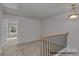 View of a second floor landing showcasing neutral walls and carpet at 5153 Tommy Ln # 1104, Stanley, NC 28164