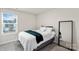 Comfortable bedroom with natural light, a full bed, neutral walls, and modern mirror at 518 Tayberry Ln, Fort Mill, SC 29715