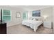 Comfortable bedroom with natural light, a queen bed, neutral colors, and modern decor at 518 Tayberry Ln, Fort Mill, SC 29715