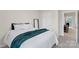 Cozy bedroom with natural light, a full bed, neutral walls, and plush teal throw at 518 Tayberry Ln, Fort Mill, SC 29715