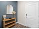 Modern entryway with stylish console table, decorative mirror, and neutral color palette at 518 Tayberry Ln, Fort Mill, SC 29715
