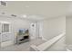 Upstairs landing features a tv, and doors leading to a laundry room and bathroom at 518 Tayberry Ln, Fort Mill, SC 29715