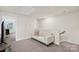 Hallway features a comfortable white sofa for relaxing with a doorway leading into another room at 518 Tayberry Ln, Fort Mill, SC 29715