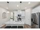 Spacious kitchen featuring an island with barstools, stainless appliances and ample cabinet space at 518 Tayberry Ln, Fort Mill, SC 29715