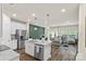 Open-concept kitchen featuring stainless steel appliances, granite countertops and island seating at 518 Tayberry Ln, Fort Mill, SC 29715