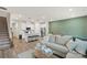 Inviting living room open to kitchen features modern white cabinets and a cozy sectional sofa at 518 Tayberry Ln, Fort Mill, SC 29715