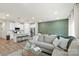 Open floor plan showcases a spacious living room with a cozy sectional and eat-in kitchen at 518 Tayberry Ln, Fort Mill, SC 29715