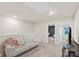 Bright loft area featuring neutral walls, a cozy sofa, and access to other rooms at 518 Tayberry Ln, Fort Mill, SC 29715