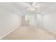 Bright bonus room with natural light, neutral carpet, and spacious open floor plan at 601 Carver Pond Ln, Waxhaw, NC 28173