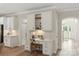 Cozy home office nook features white cabinets, desk, and a chair, offering a functional and stylish workspace at 601 Carver Pond Ln, Waxhaw, NC 28173