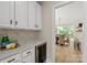 A bar area with a wine fridge is near the dining room, creating a convenient and elegant space at 601 Carver Pond Ln, Waxhaw, NC 28173