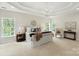 Spacious primary bedroom with large windows, trey ceiling, and elegant decor at 601 Carver Pond Ln, Waxhaw, NC 28173