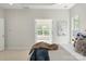 Bright and airy main bedroom leads into sunroom, creating a relaxing and inviting atmosphere at 601 Carver Pond Ln, Waxhaw, NC 28173